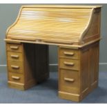 A 20th century blonde oak roll top desk, 143 x 127 x 77cm