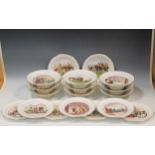 An early 20th century Wedgwood porcelain dessert service, each plate decorated with hunting and