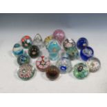 A collection of paper weights to include Murano, millefiori type and Bohemia glass etc