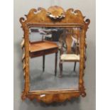 An 18th century style walnut and parcel gilt fret-framed wall mirror, 84 x 58cm