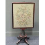 A Regency mahogany fire screen with lift up needle work panel, 57 x 104cm