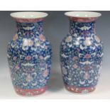 A pair of large famille rose vases decorated with auspicious symbols, with red rubber seal mark to