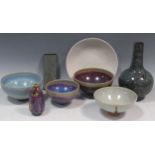 Four Chinese 'Jun' bowls, a white 'Ding' style dish, a mottled glaze vase, a small bottle vase, a