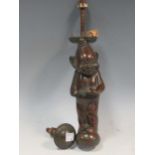 A bronzed metal door knocker with lucky imp motif 23cm high