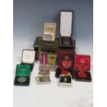 A small collection of medals and medallions, some Pinches and cased, waxed seals etc., together with