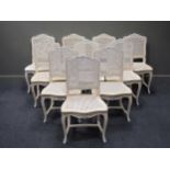 A set of ten Louis XV style white and blue painted dining chairs with caned backs and seats (10)