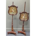 A pair of 19th century needlework pole screens, 154cm and 155cm high