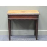 An early George III mahogany tea table, with rectangular foldover top and moulded edge, 75 x 82 x