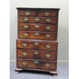 A George III mahogany chest on chest, the dental moulded cornice above a combination of two short