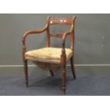 A Regency mahogany dining armchair, on ring turned front legs; and a late Victorian mahogany
