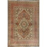 An early 20th century Kashan rug with rust coloured medallion 174 x 122cmColour generally quite