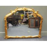 A Rococo style gilt framed wall mirror of arched form, 96 x 117cm