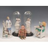 A collection of figures including a Lladro architect, Chinese doll, a child in a highchair and a