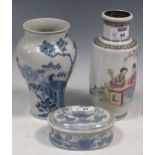 A Chinese vase decorated with two figures seated at a table, 20cm high; a Chinese blue and white