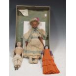 A bisque head doll; together with two others one with wax head and straw stuffed arms (3)