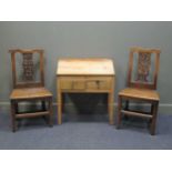 Two similar 18th century carved oak side chairs together with an elm bureau with hinged top (81 x