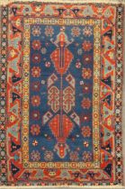 A Kazak style blue ground rug, 155 x 103cm