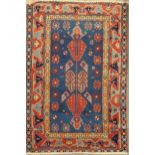 A Kazak style blue ground rug, 155 x 103cm