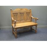 A carved oak hall bench c.1900, 113 x 109 x 50cm