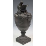 A 19th century Wedgwood black basalt classical urn 40cm high (lacking handle)Collection of dust