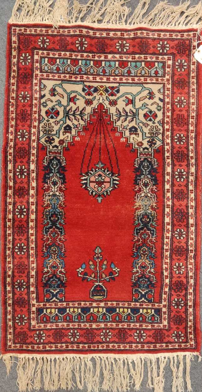 Two 20th century prayer rugs, with a Belouchi mat, largest measuring 135 x 93cm