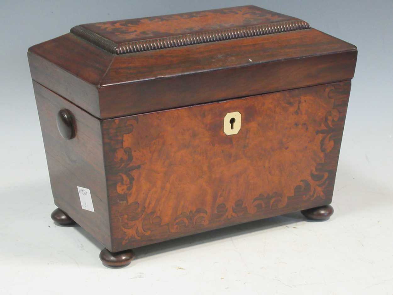 A 19th century rosewood tea caddy, the hinged lid enclosing a two partition interior, 15 x 20 x 12.