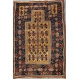 A late 19th century Belouchi prayer rug, with sand coloured field130 x 89cm