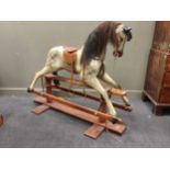 Haddon Rocking Horses of Wallingford - a child's dapple-grey rocking horse, having tan leather