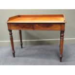 A 19th century mahogany writing desk with gallery top over two drawers, 84 x 106 x 55cm