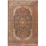 An early 20th century Kashan rug of classic design in traditional colours 206 x 133cm