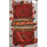 An Afghan saddle bag, a hanging, and saddle cover (3)