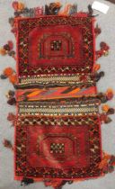 An Afghan saddle bag, a hanging, and saddle cover (3)