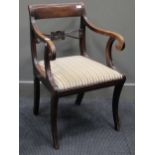 A bar back elbow chair with sabre legs