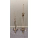A matched pair of two brass standard lamps with shield and floral details, tallest 161cm high (2)