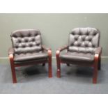 zzz A pair of Danish brown leather upholstered easy armchairs