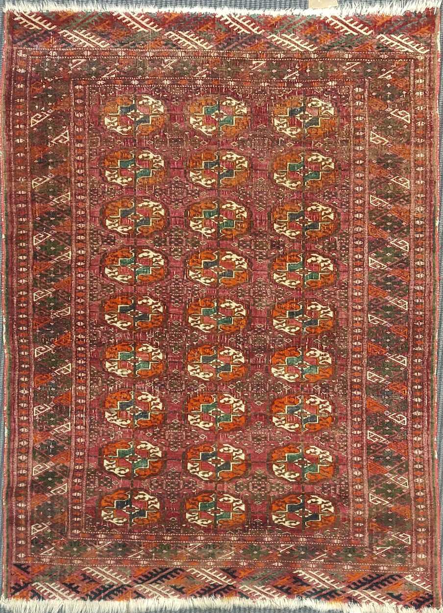 An early 20th century Tekke turkmen with unusual green quartering 118 x 84cm