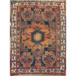 An Afsher rug with bold central medallion, 168 x 123cmVery worn, pile thinned, especially to the