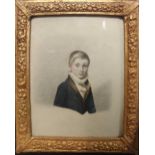 A 19th century watercolour portrait of a boy, bust length in ebonised and gilt frame, overall size