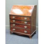 An Edwardian mahogany four drawer bureau 97 x 78 x 50cm wide, a faded mahogany Sutherland table,