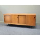 A pair of 1950’s sycamore side cabinets, on square feet, 75 x 183 x 45.5cm