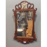 A mahogany mirror with hoho bird, 19th century, 70 x 41cm