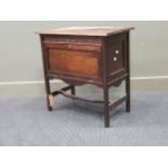 An Edwardian varnished oak small chest, with fall front with twin panelled drawers, 67 x 66 x 38cm