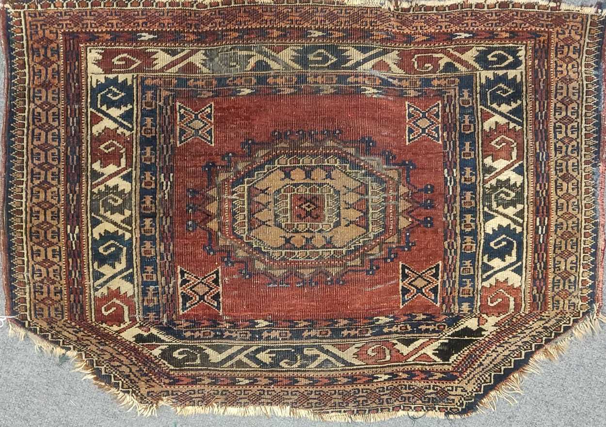 An unusual Turkmen bagface and a pair of bagfaces, 90 x 64cm, 63 x 56cm, 60 x 55cm