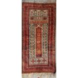 Two similar Belouchi prayer rugs,142 x 77cm, 148 x 82cm