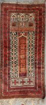 Two similar Belouchi prayer rugs,142 x 77cm, 148 x 82cm