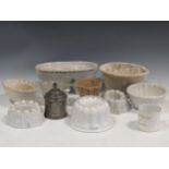 A collection of nine ceramic jelly moulds including the British lion blanc mange mould; together
