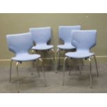 zzz A set of four blue upholstered Danish stacking chairs