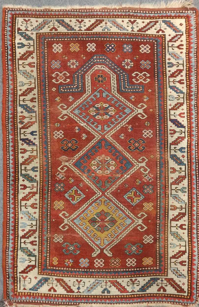 A late 19th century Kazak prayer rug 173 x 115cmVery worn especially the middle sectionPile is quite