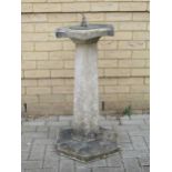 A sundial on a composite base, 89cm high