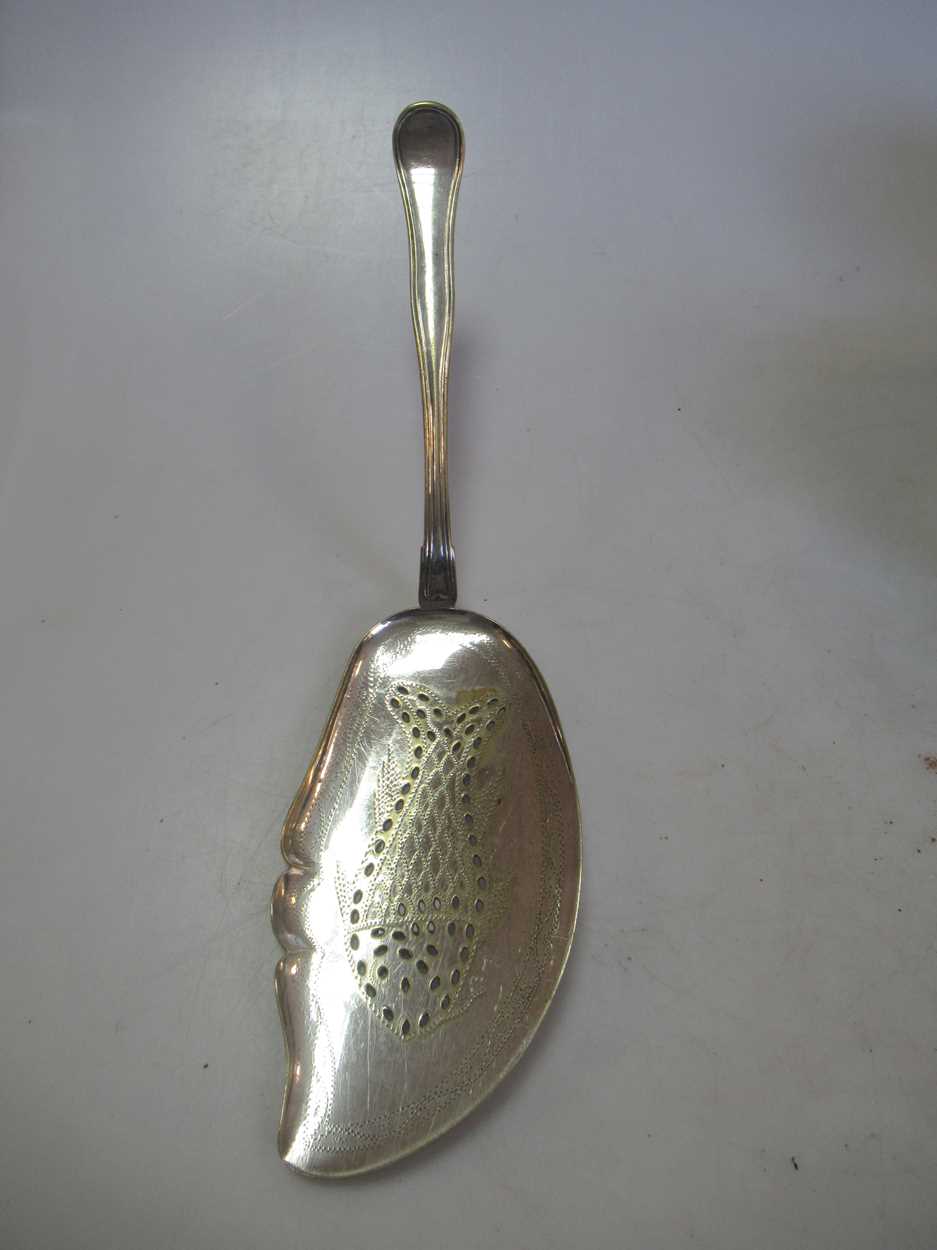 A Danish silver fish slice, a Dutch silver caddy spoon an 18th century silver cream jug, a silver - Image 3 of 5